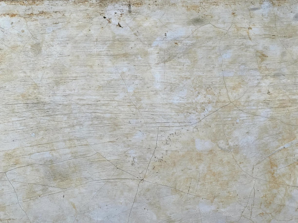 一张脏兮兮的墙上的照片，墙上有一个红色的小东西，墙上有白色和棕色的油漆。图片下载