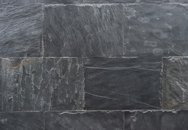 深灰色石板的抽象背景。图片下载
