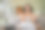 一位女士坐在客厅的沙发上，对着电风扇吃着新鲜的西瓜图片下载