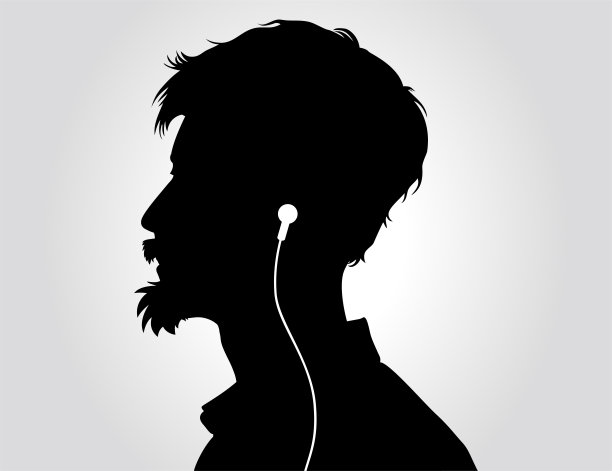 男人戴着耳机听音乐的肖像。图片下载