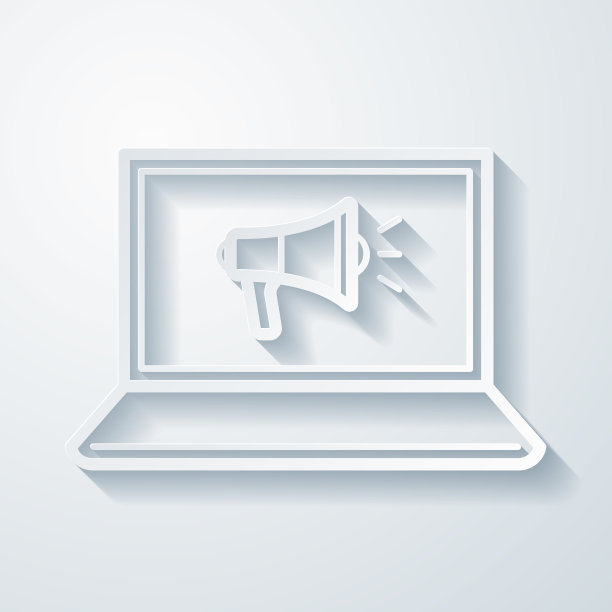 带扩音器的笔记本电脑。空白背景上剪纸效果的图标图片下载