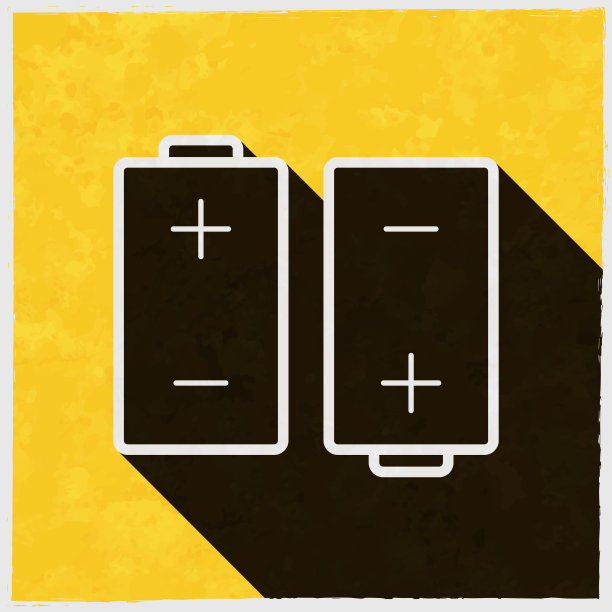两个电池。图标与长阴影的纹理黄色背景图片下载