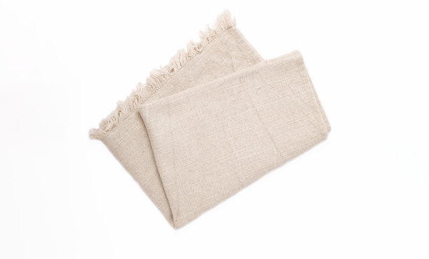 厨房毛巾。白色背景上的棉餐巾。野餐毛巾。家用纺织品。折叠布。食物服务设计元素。广场餐巾。图片下载