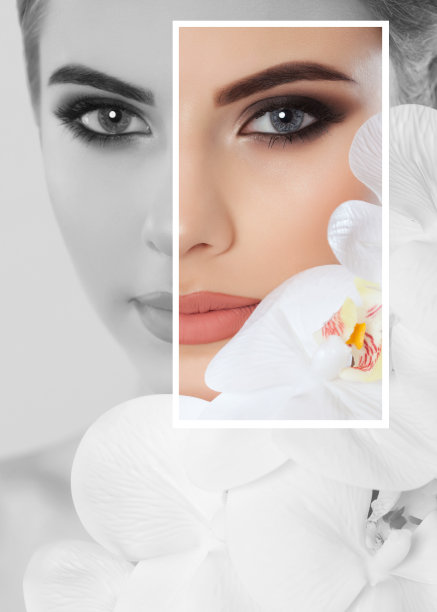 画像上的女人化着漂亮的妆，手里拿着一朵白兰花。专业的化妆和护肤。图片下载