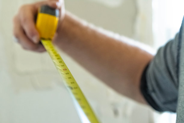 家用卷尺，装修墙面，修补墙面抹灰图片下载