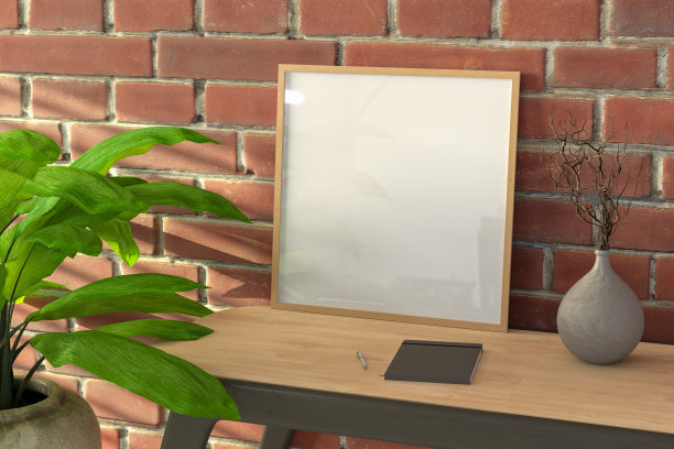 木制桌子和红色砖墙上的方形木制框架模型。图片下载