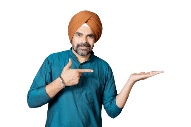 自信的印度锡克教男子肖像在工作室广告概念，一个男人的肖像在头巾显示他的手掌，指向手掌图片下载