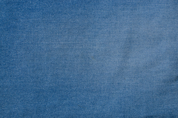 细节上的牛仔纹理特写，突出交织在一起的线条，增添了一丝原创性。非常适合时尚，风格和室内设计项目。图片下载