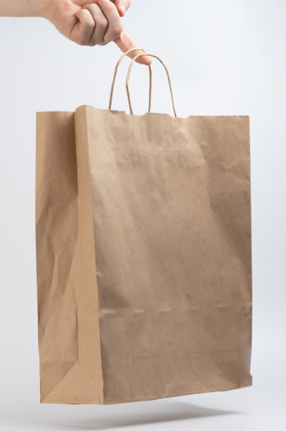 手指握住轻纸袋图片下载