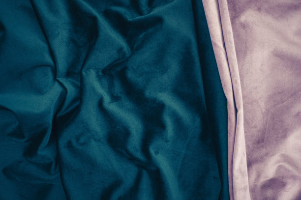 粉红色和深蓝色天鹅绒与折叠背景图像，蓝色织物丝绸为背景网页设计壁纸，蓝色和粉红色的纺织品背景的美丽组合图片下载