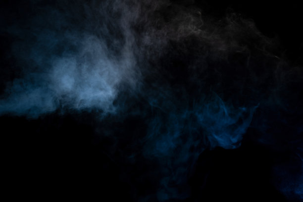 蓝色和黄色蒸汽在黑色的背景。图片下载