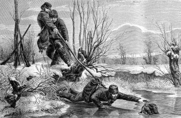 猎人在冰上试图抓住他的狗图片下载