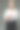 演播室里穿着灰色背景白衬衫的金发女商人。肖像图片下载