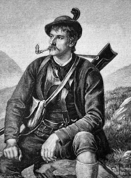 戴着麂皮胡子帽，穿着皮短裤的年轻野兽猎人图片下载