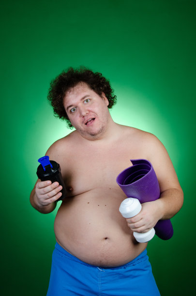 节食的滑稽胖子。健康的生活方式和运动。图片下载
