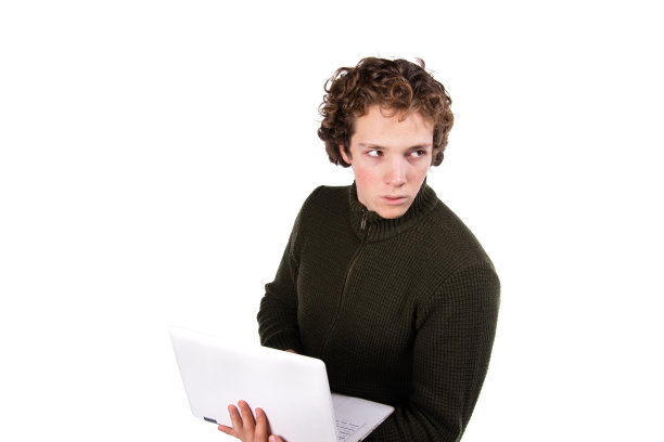 带着笔记本电脑的帅哥。图片下载