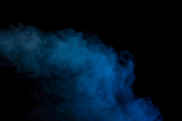 蓝色和黄色蒸汽在黑色的背景。图片下载