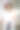 戴着安全帽的年轻女建筑师面带微笑，手里拿着图纸，看着镜头。施工经理，经理，施工现场的工程师。垂直图图片下载