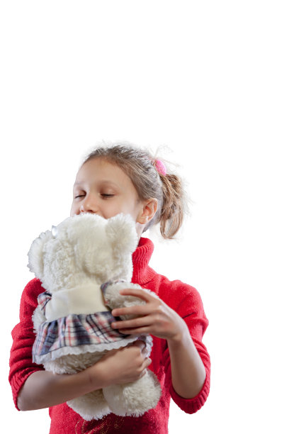 小女孩抓着她的泰迪熊玩图片下载