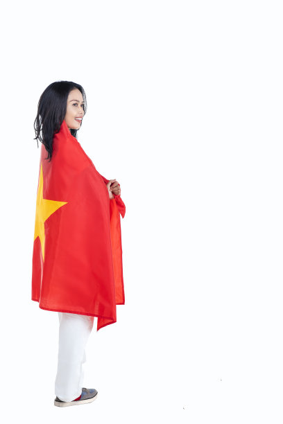 亚洲女性手持越南国旗庆祝9月2日越南国庆日图片下载