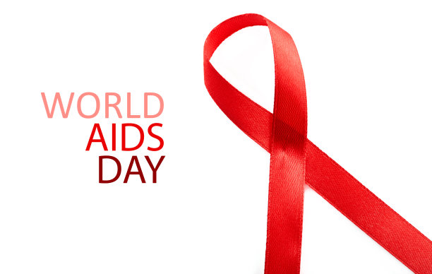 艾滋病意识标志红丝带。世界艾滋病日概念，12月1日。红色丝带作为艾滋病意识的象征，白色。图片下载