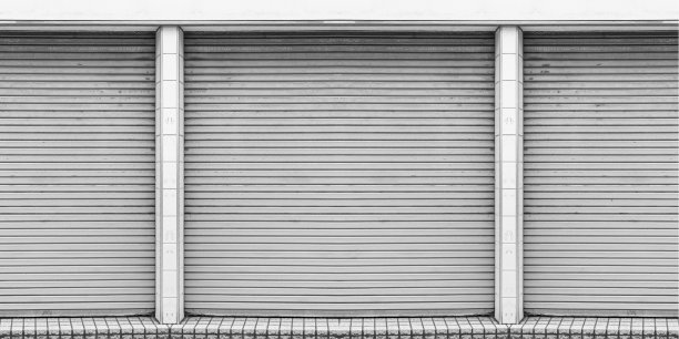 钢卷帘门的仓库，仓库或店面为封闭的金属门背景和纹理。图片下载