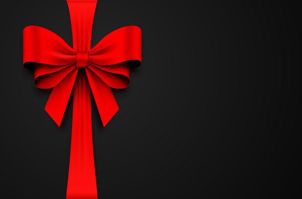 红色礼品蝴蝶结与缎带在黑色背景图片下载