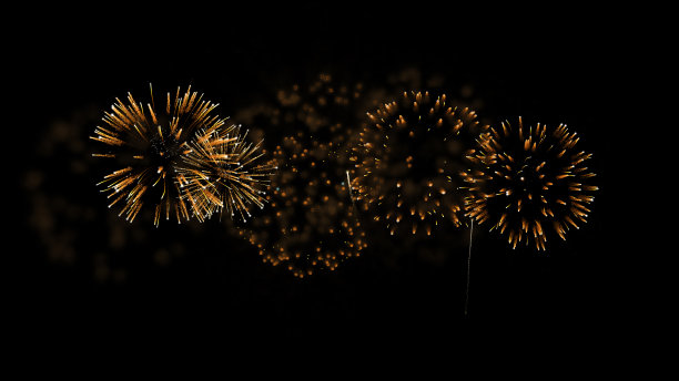 烟花的背景。抽象的金色闪闪发光的烟花表演。图片下载