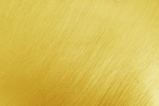 纹理的旧黄色金色铝金属与划痕为背景。图片下载