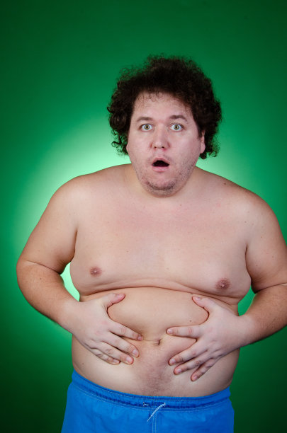 节食的滑稽胖子。健康的生活方式和运动。图片下载