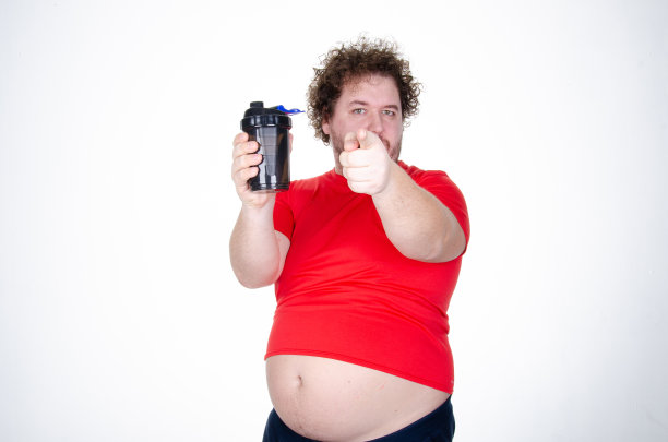节食的滑稽胖子。健康的生活方式和运动。图片下载
