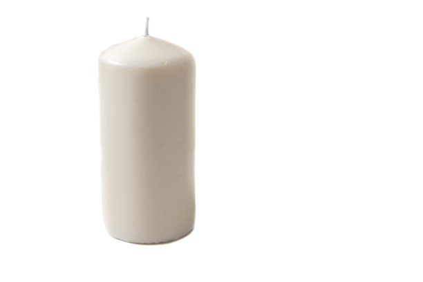 一支崭新的白色蜡烛。孤立在白色背景上。图片下载
