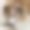 欢快的棕色澳大利亚牧羊犬心满意足地躺在舒适沙发旁边的地板上图片下载