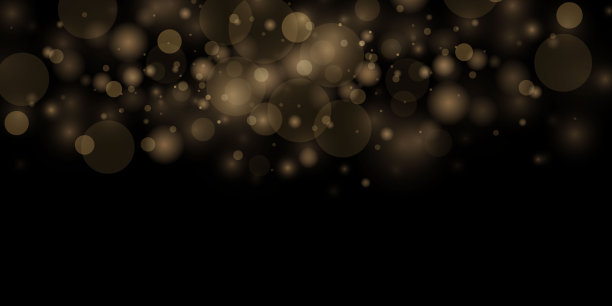 黑色背景上闪闪发光的金色仙尘颗粒。图片下载