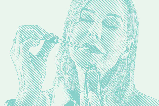 妇女手持一瓶精油和吸管的特写镜头图片下载