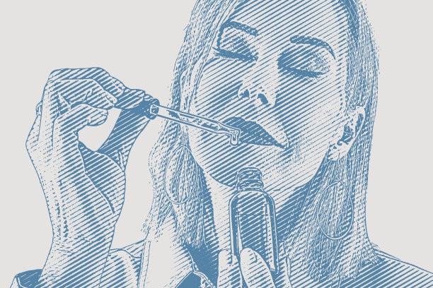 妇女手持一瓶精油和吸管的特写镜头图片下载