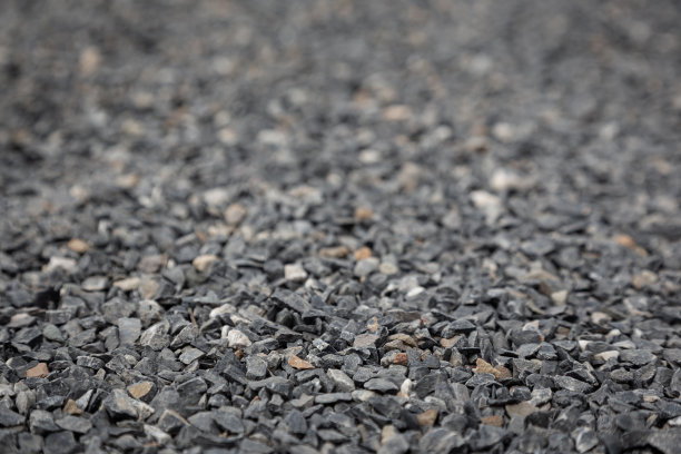 壁纸图片的灰色花岗岩鹅卵石地板与模糊的背景为平面设计工作图片下载