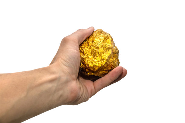 男性手中的金块，孤立的白色背景。图片下载