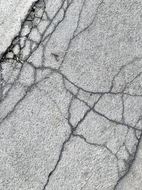 街道上混凝土的裂缝，沥青的裂缝和地面上的裂缝的照片。图片下载