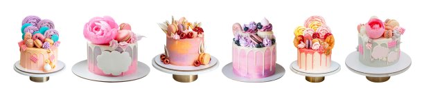 各种粉红色的蛋糕孤立在白色的背景上。有泰迪熊、可食用花朵、独角兽、棉花糖、蛋白霜和马卡龙的蛋糕图片下载