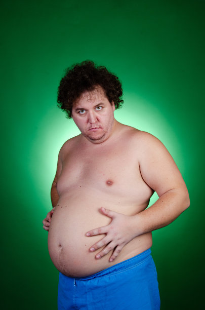 节食的滑稽胖子。健康的生活方式和运动。图片下载