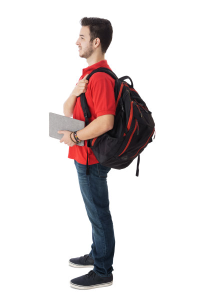 侧面的学生拿着背包和笔记本电脑图片下载
