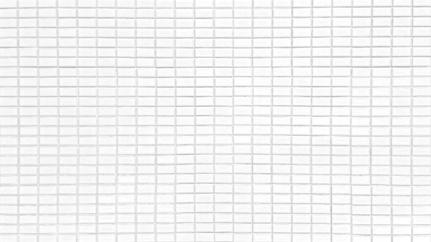 近距离亮白色马赛克墙砖。长方形瓷砖，浅灰色。复古马赛克厨房墙面图案作为背景。图片下载