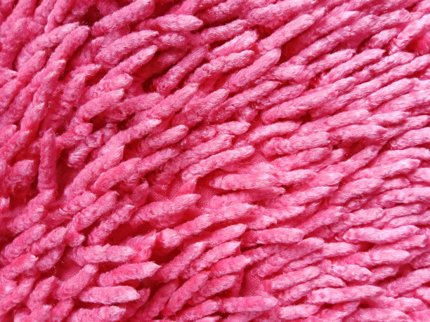 粉红色的门垫背景纹理。地毯质地。图片下载
