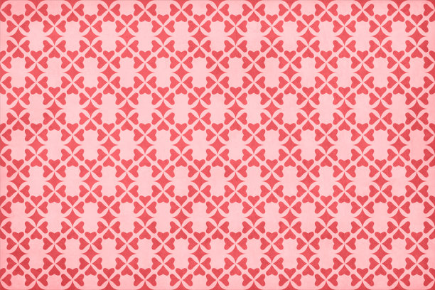 明亮的充满活力的红栗色心形图案在粉红色的垃圾色背景上形成一个花卉图案图片下载