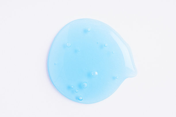 透明的蓝色化妆品样品纹理与气泡。化妆品脱皮凝胶。化妆品蓝色脱皮凝胶，美容质感背景图片下载