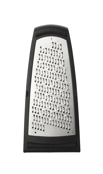 白色背景上的不锈钢刨丝器。厨房用具图片下载