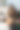 专业女美容师用棉签轻轻擦拭客户面部图片下载