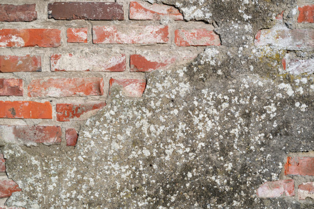 砖墙与破碎的灰泥作为背景使用图片下载