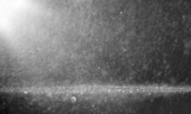 抽象粒子闪烁与闪亮的浮尘粒子耀斑，庆祝背景图像与复制空间。图片下载